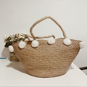 Bali handmade basket bag with pom poms